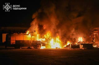 Firefighters put out a fire following a Russian attack in Odesa in Ukraine